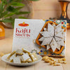 Refined Indulgence: Kaju Sweet with Elegant White Roses